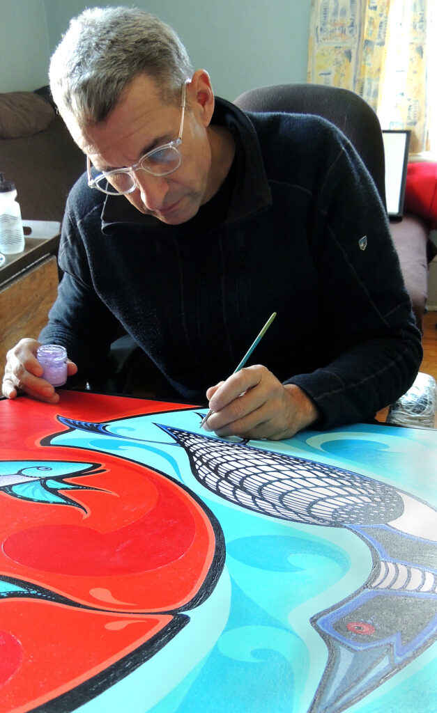 Artist Mark Kulas working on his painting titled Trading Places